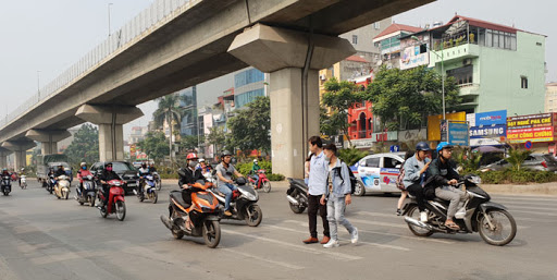 Vietnam — Crossing the road in Hanoi, Vietnam